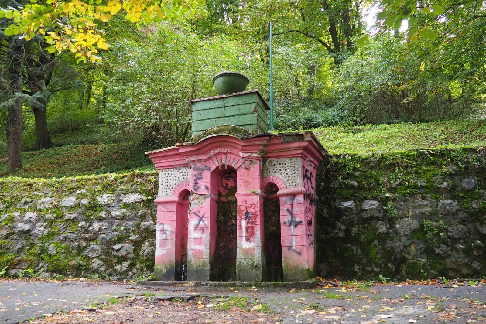 Banja Koviljaca, Serbia, Guchevo, Loznica, September 30, 2022. Rehabilitation center with sulfur and iron mineral waters. Spring with mineral natural water -Three sources. A scribbled pedestal