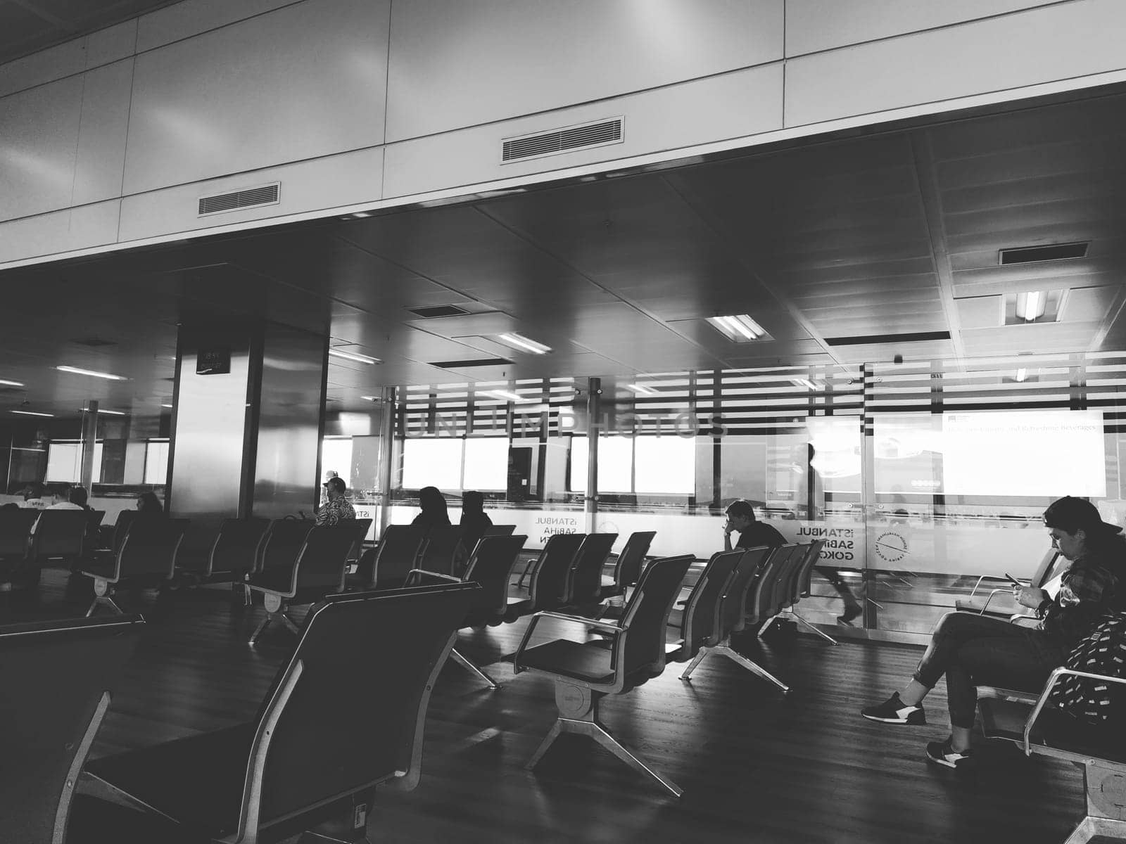 Istanbul Turkey, Sabiha Gokcen Airport Uluslararasi Havalimani 04.08.2022 The waiting room at the airport for stay of passengers. People passengers waiting to board the flight. Airport interior.