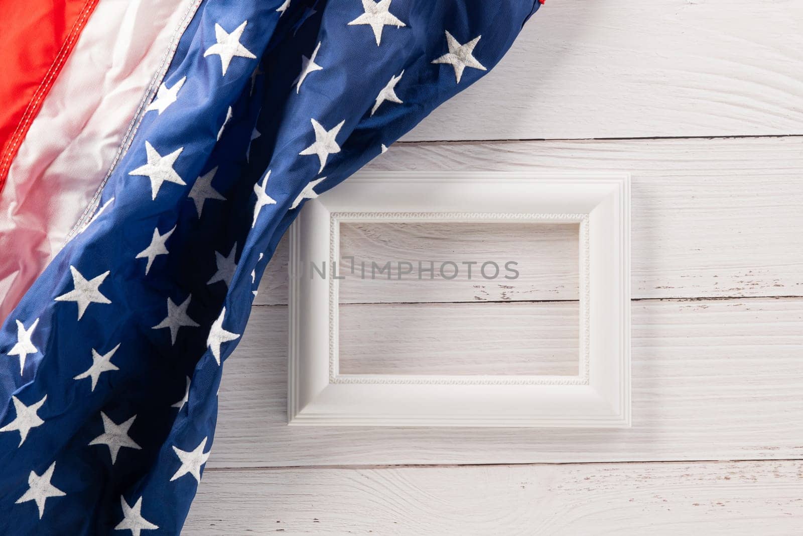 Above flag of United States American with photo frame, USA flag for Memorial day on abstract wooden background, Banner template design of presidents day concept, holiday background