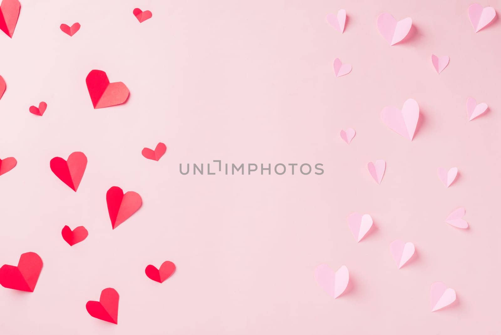 Valentines' day background. Pattern beautiful red and pink paper hearts cut composition greeting gift card isolated on pink background with copy space, Symbol of love Top View from above