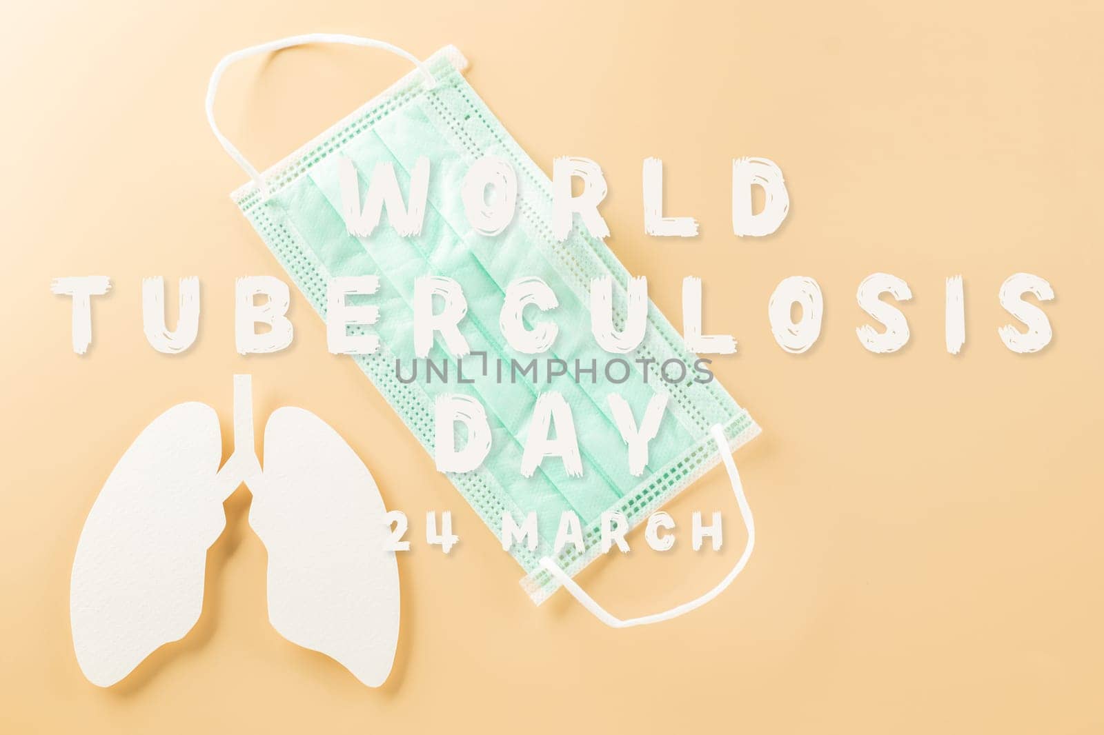 World Tuberculosis Day. Overhead lungs paper symbol and facial medical face mask on pastel background, lung cancer awareness, copy space concept of world TB day, banner background, pneumonia awareness