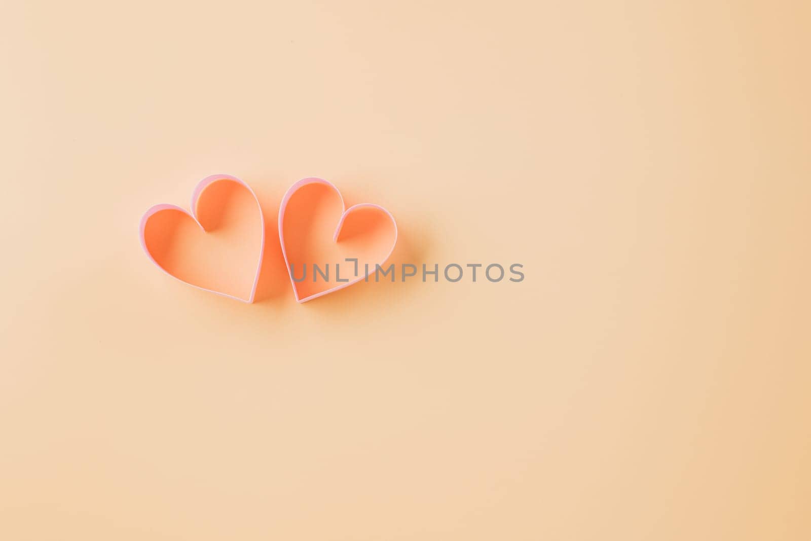 Top view flat lay pink ribbon heart shaped decorative symbol on pastel background, love romance concept, template banner design with copy space, Mother, Women's day, Happy Valentines Day