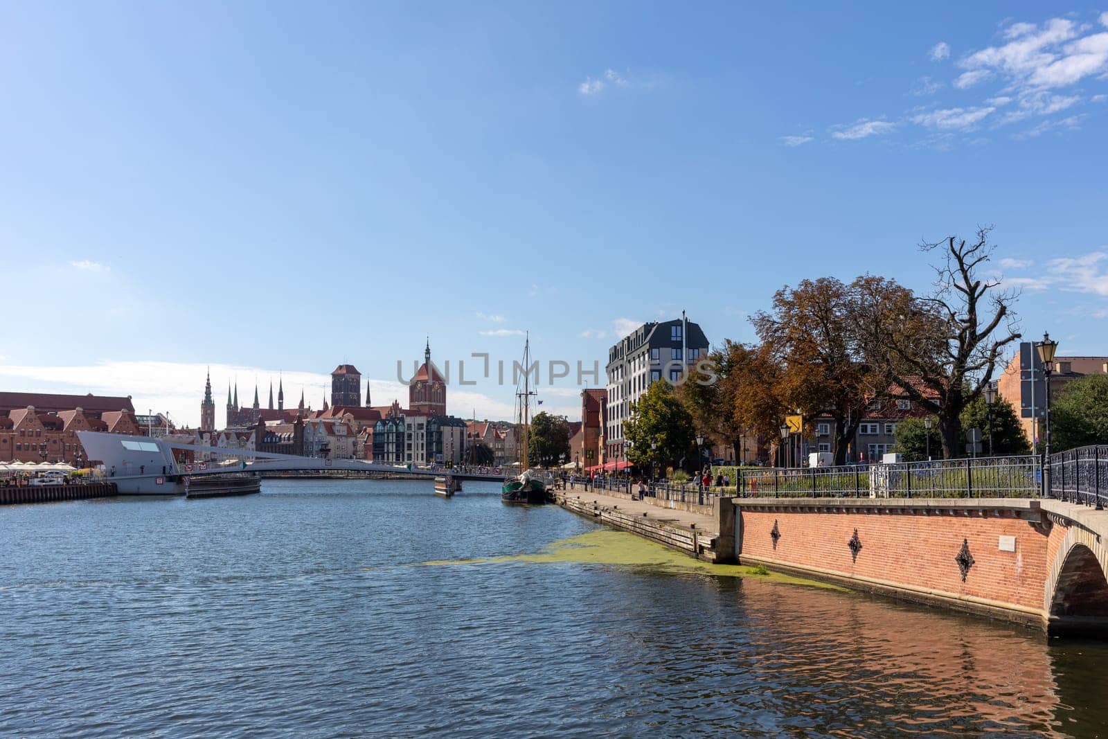 Gdansk, Poland - Sept 9, 2020: Gdansk, Old Town - historic buildings along the riverbank of Motlawa River, Poland