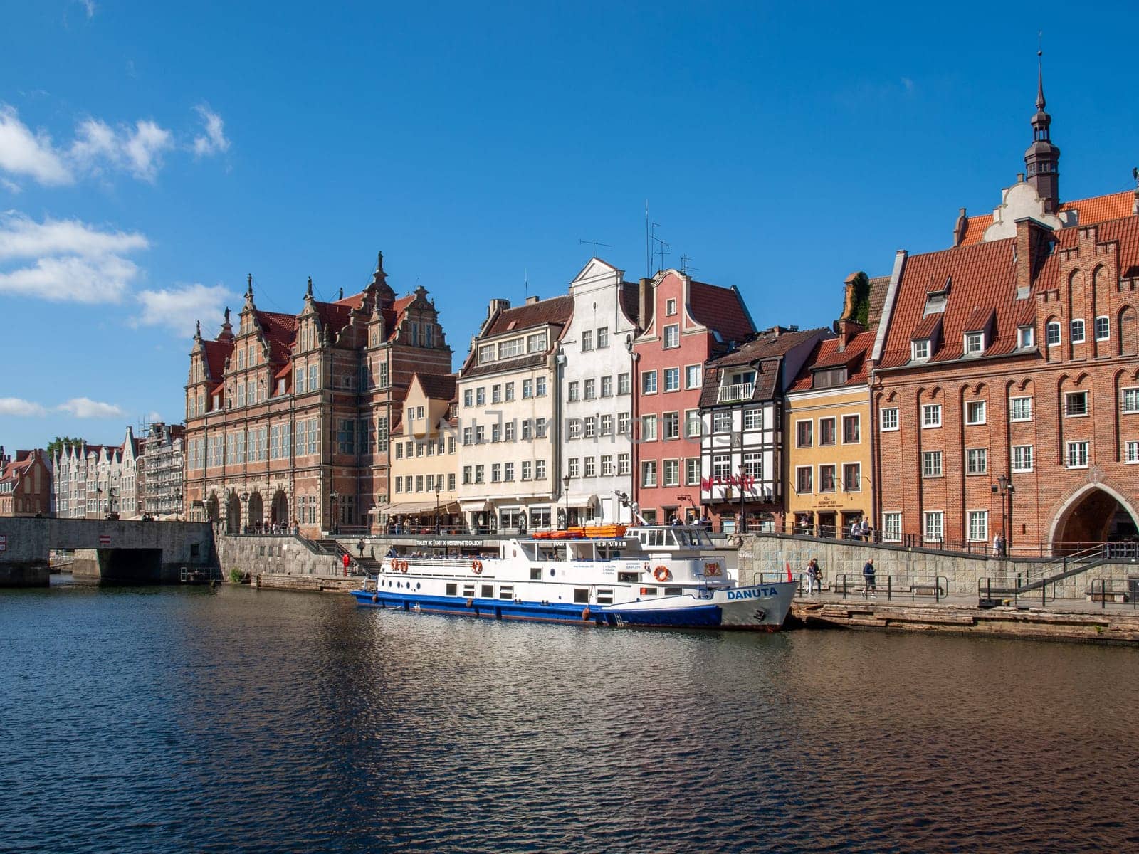 Gdansk, Poland - September 9, 2020: Passenger harbor on the Motława River and a cruise ship at Dlugie Pobrzeze in old town of Gdansk
