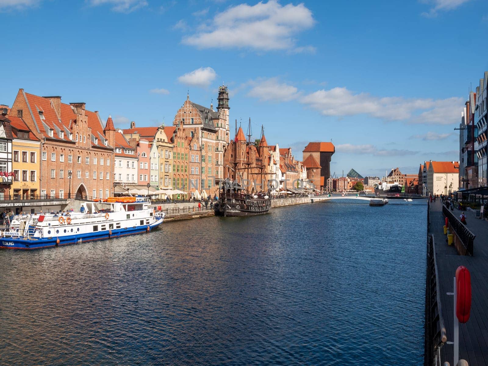Gdansk, Poland - Sept 9, 2020: Gdansk, Old Town - historic buildings along the riverbank of Motlawa River, Poland