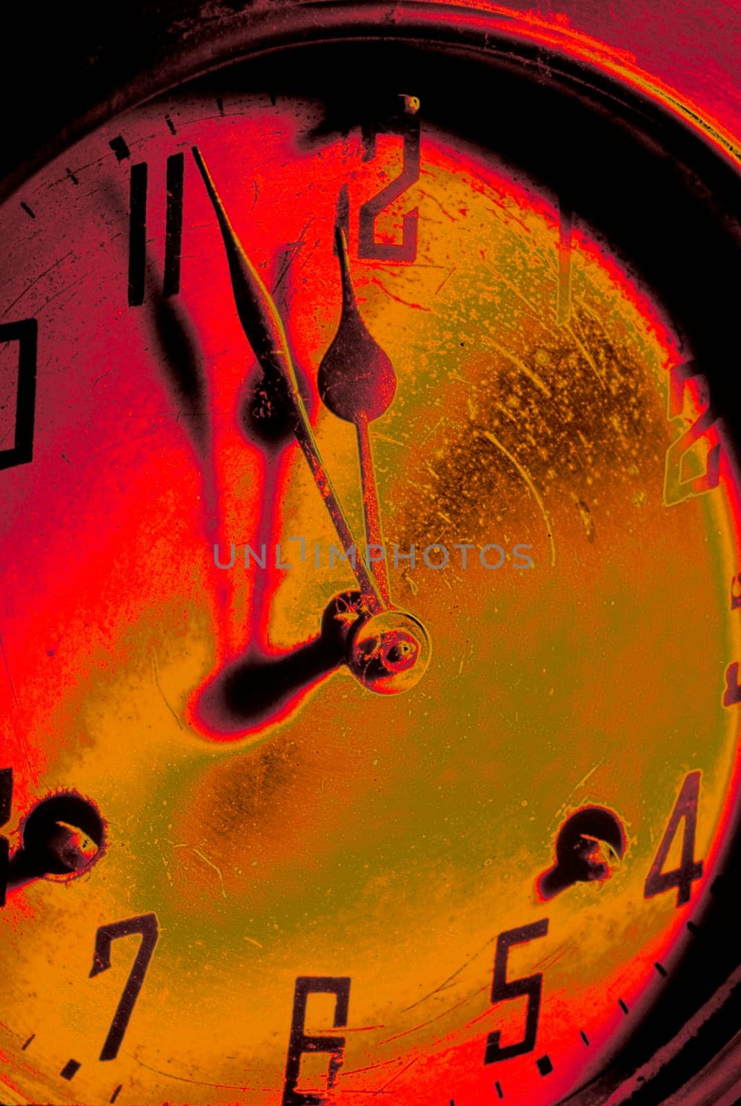 An old antique clock shows the eleventh hour just before midnight.