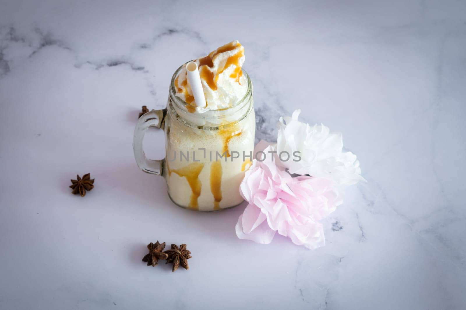 Vanilla  fresh Smootie on a marble table ready to be eat