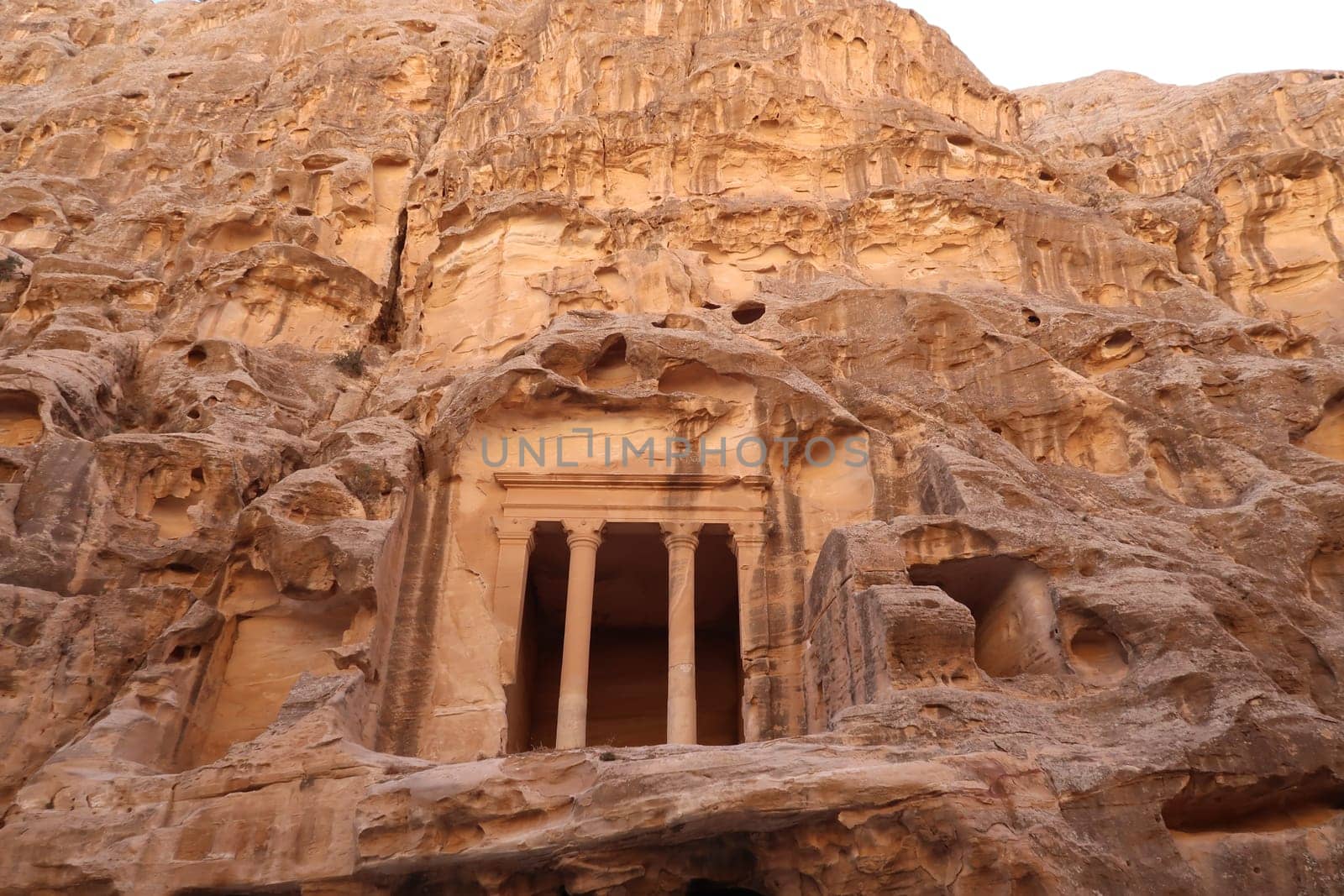 Temple above cave rooms, little Petra, Siq al-barid, Petra, Jordan 2021