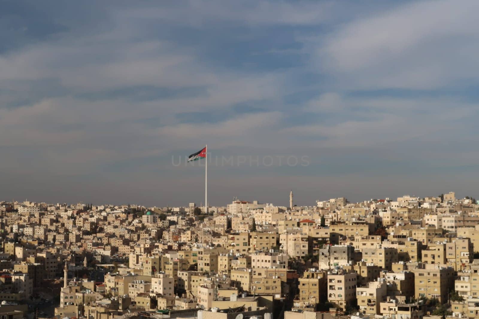 Jordanian Flag over the skyline of Amman, Jordan 2021