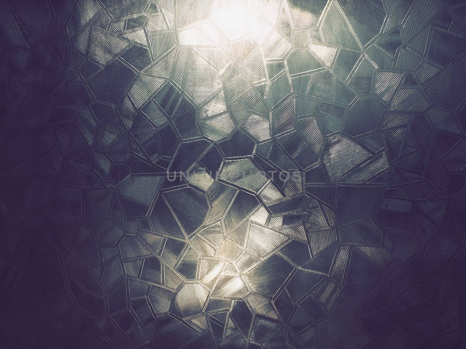 corrugated glass. Abstract pattern on a window or glass surface. Reflection and refraction of light. Protective opaque film glued to the glass.