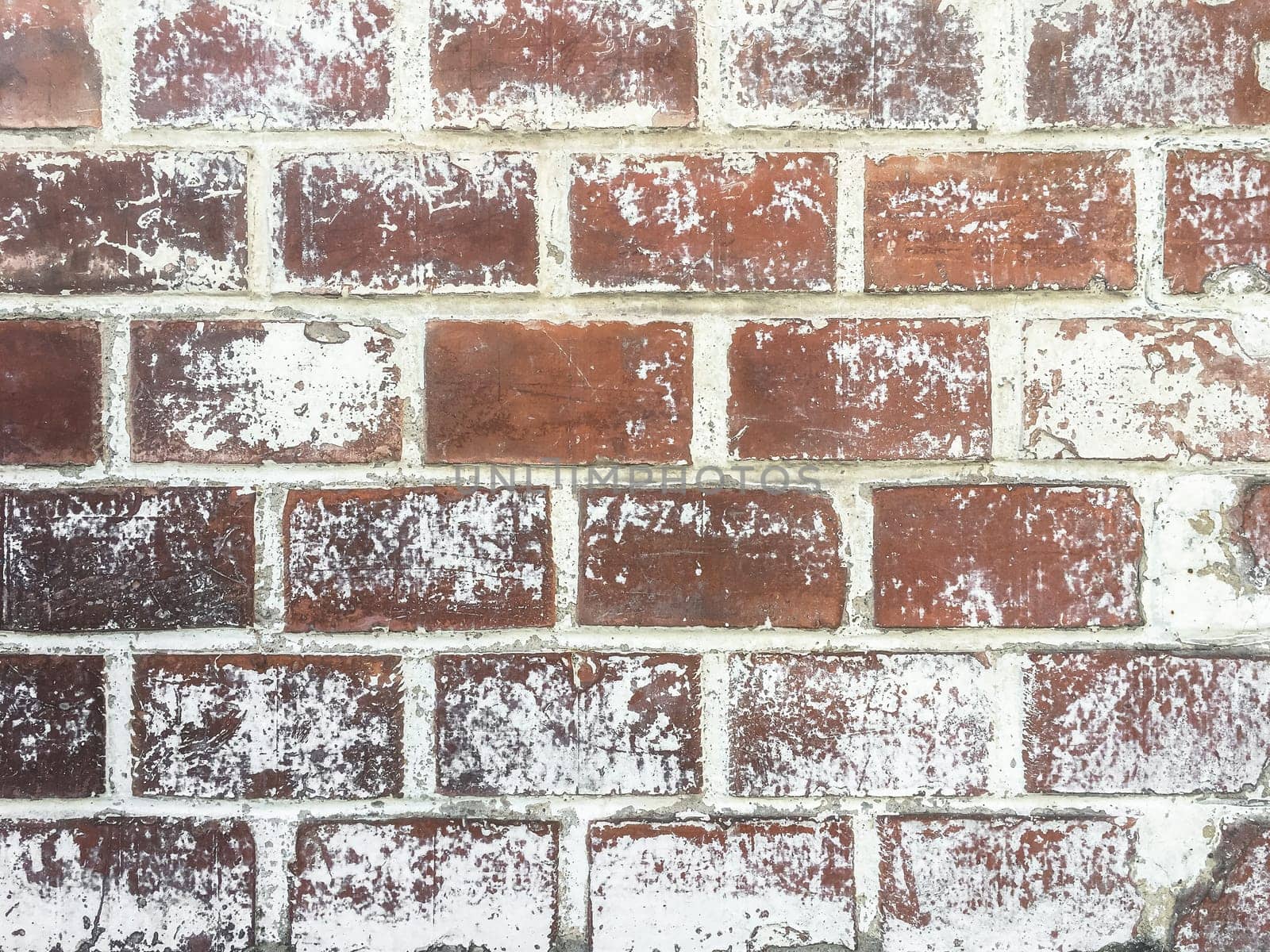 Red color brick wall. Old rough stone on cement pattern wall background. Vintage grunge wall.