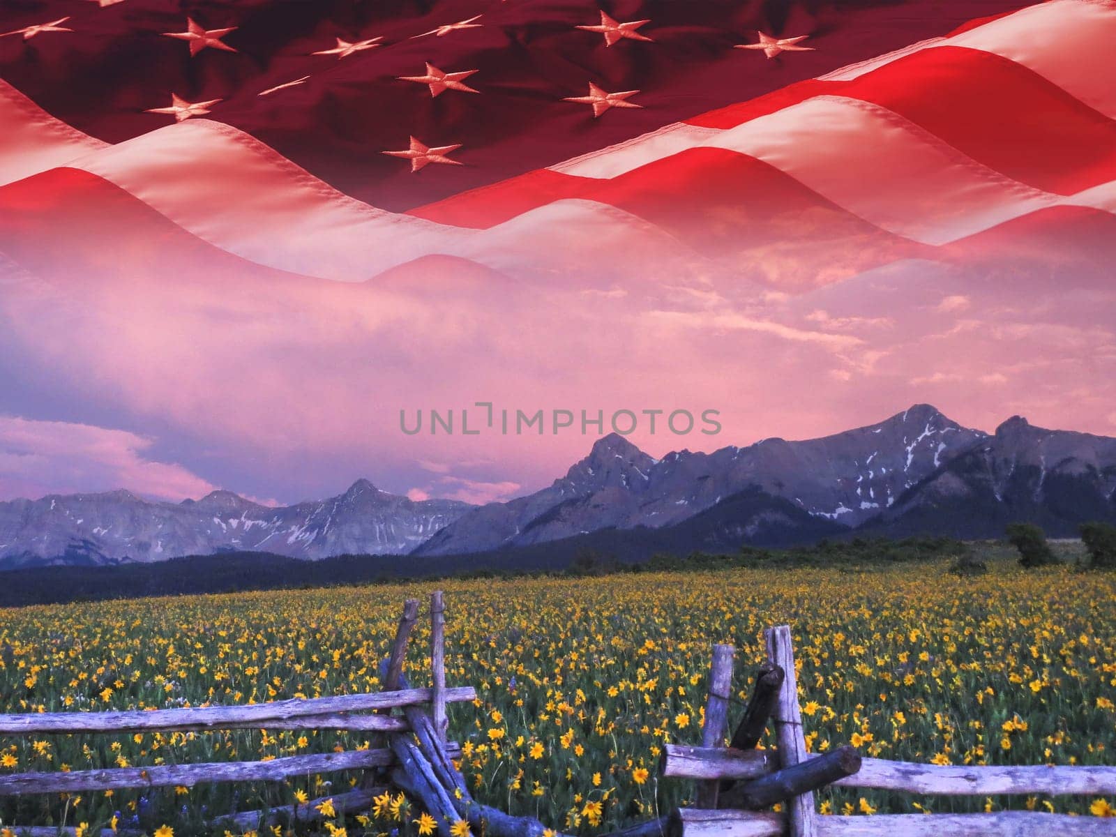 The American flag over the Rocky Mountains, Colorado.