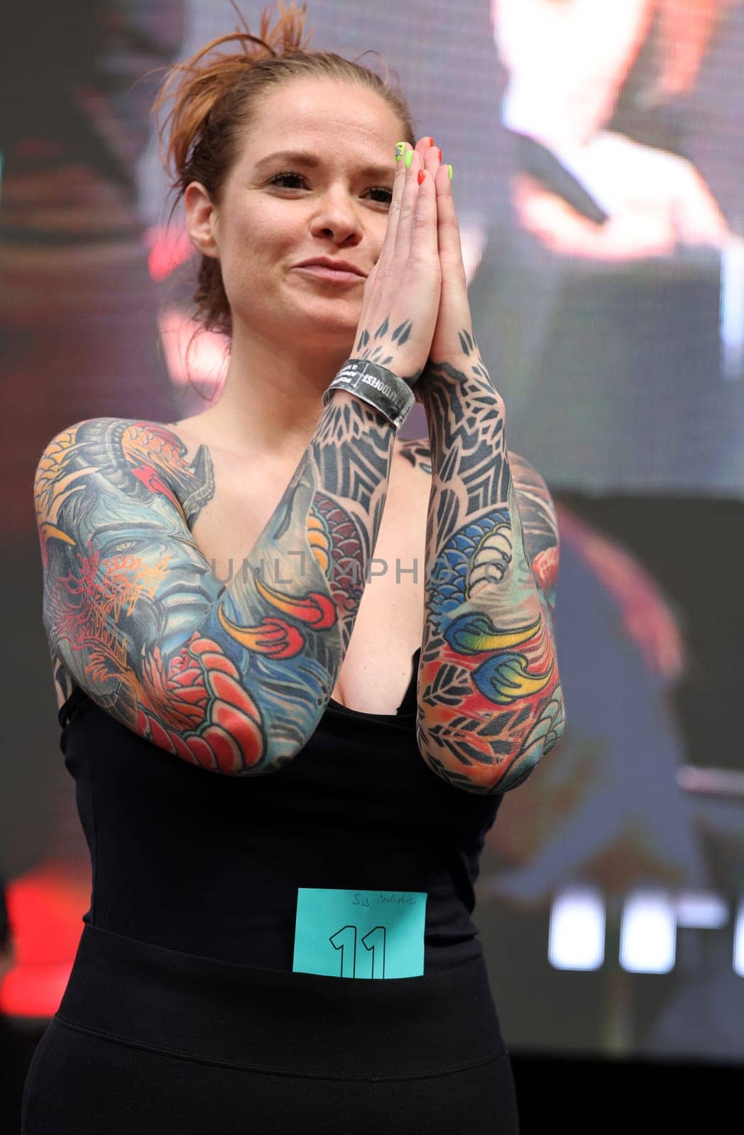 Krakow, Poland - June 12, 2022: Unidentified participant during the contest for the best tattoo at the 15th Tattoofest Convention in Cracow. One of the most prestigious tattoo festivals.