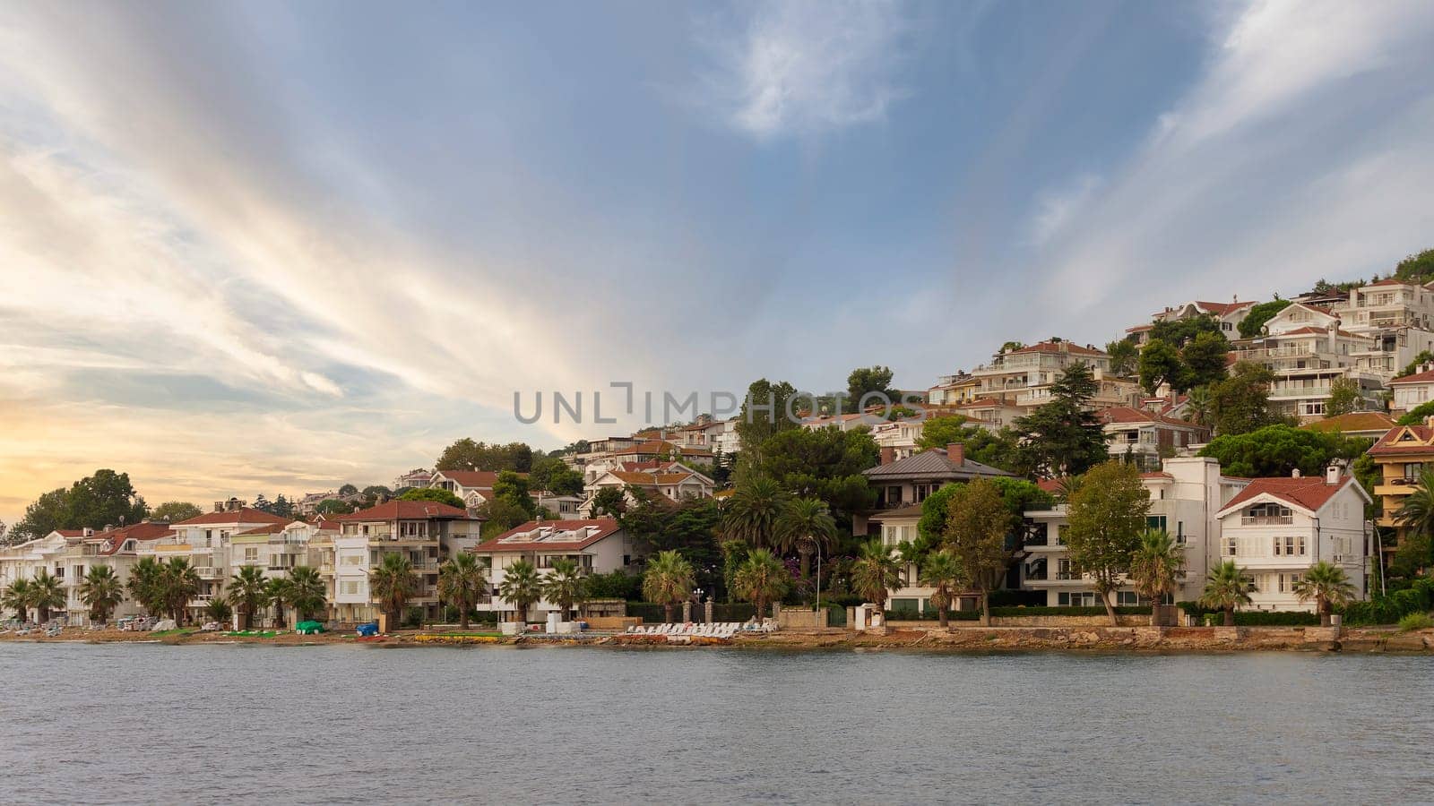 View of the hills of Kinaliada island from Marmara Sea, with traditional summer houses at dawn, Istanbul, Turkey