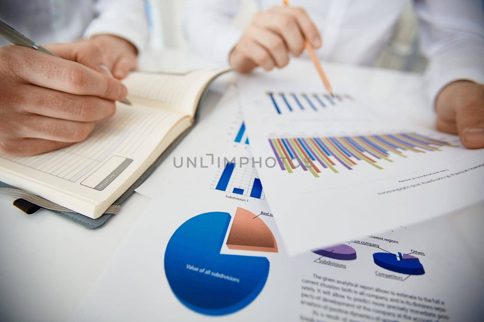 Hands of businessman during paperwork and planning