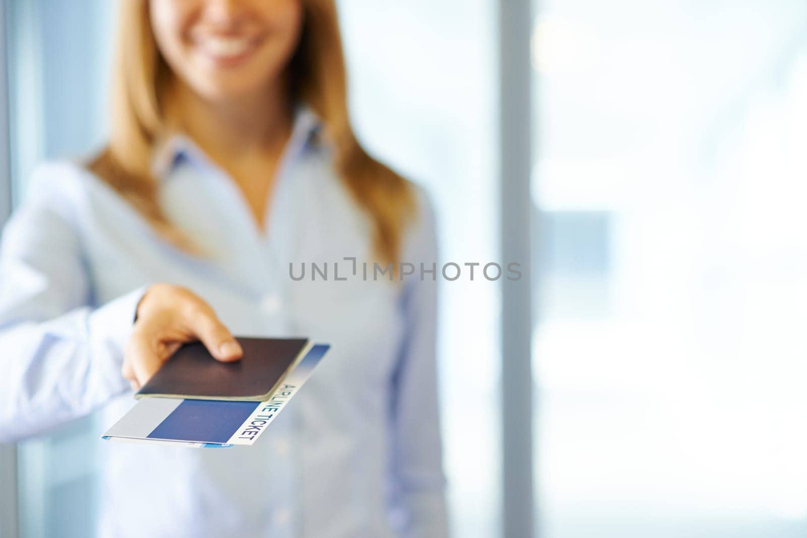 Female manager giving passport and air ticket
