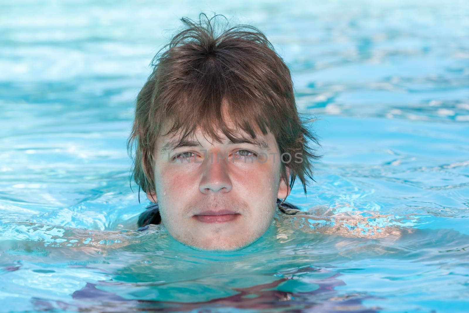 man in a swimming pool in summer