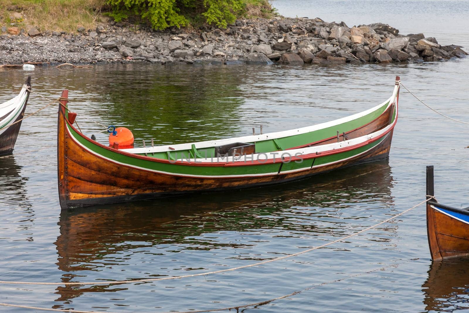 Small boat on clear water in Norway