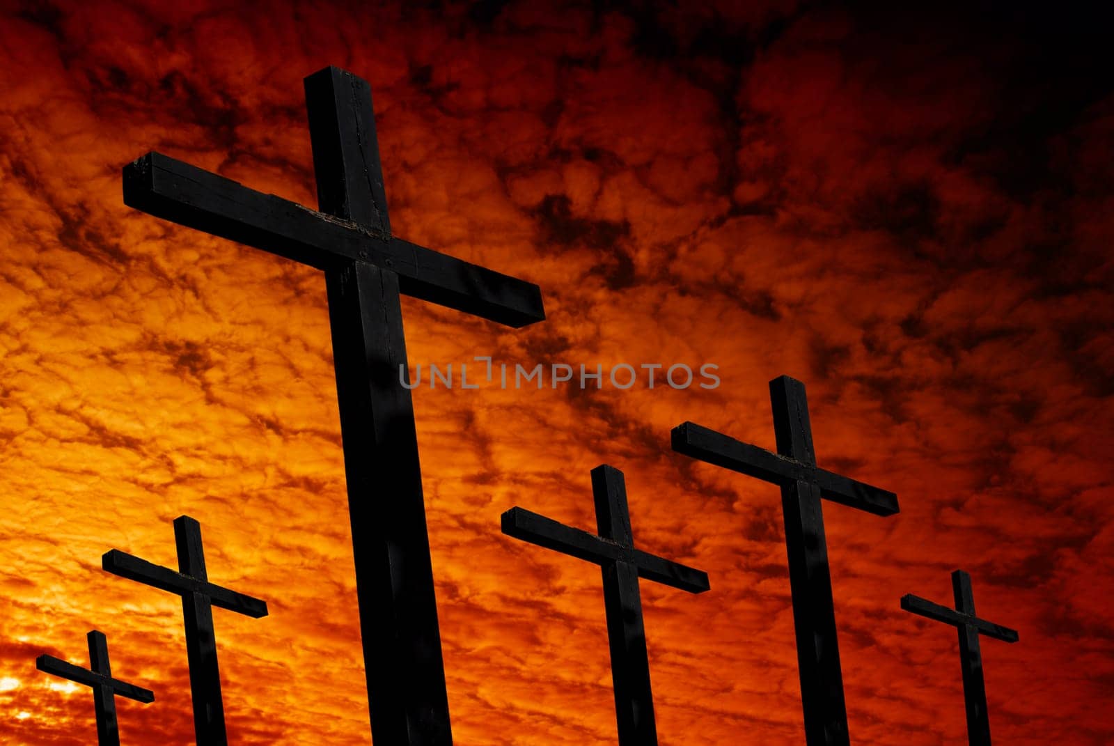 cross silhouette with the sunset as background