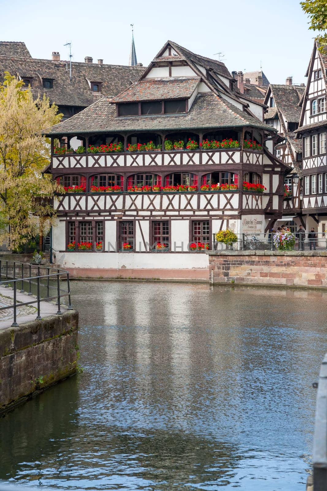 Strasbourg, water canal in Petite France area. timbered houses and trees in Grand Ile. Alsace, France.