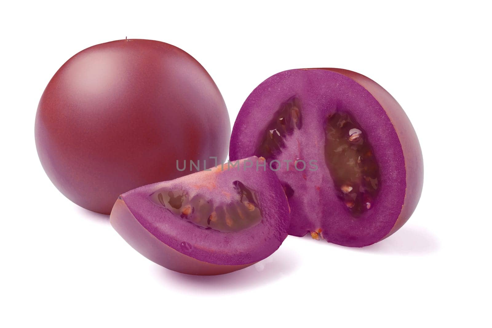 Antioxidant purple tomatoes, whole and sections isolated on white background