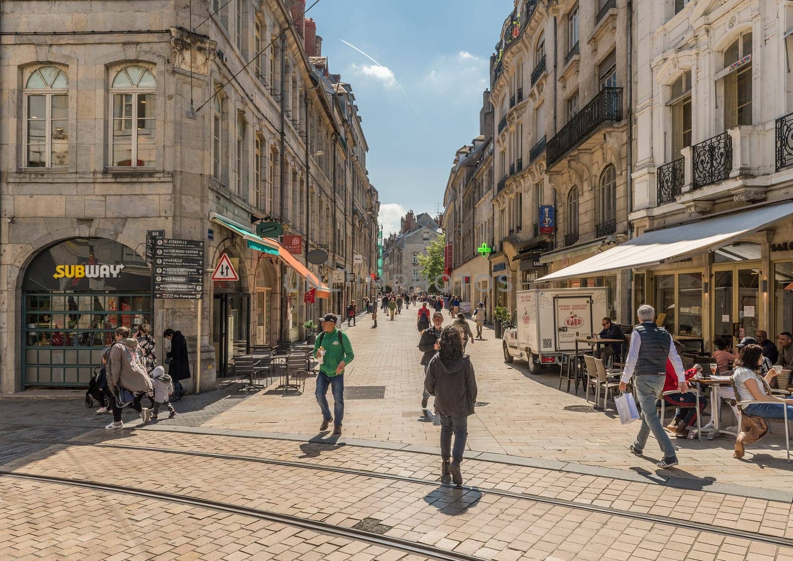 View of unidentified people on a street in Besancon, France