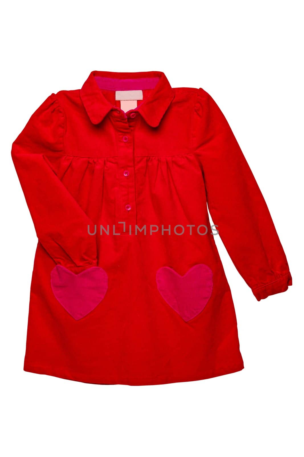 Summer dress isolated. A beautiful red girl's dress with attached heart shaped pockets and long sleeves isolated on white. Clipping path. Kids spring and autumn fashion.