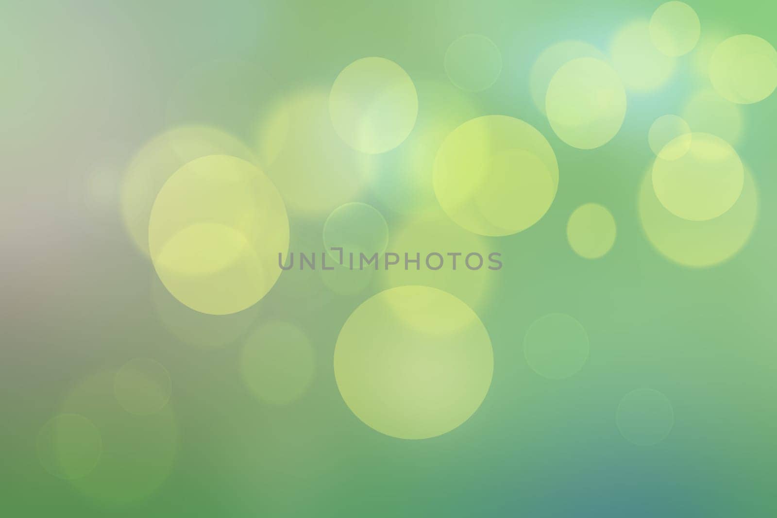Abstract delicate gradient green light and yellow pastel spring or summer bokeh background. Beautiful texture.