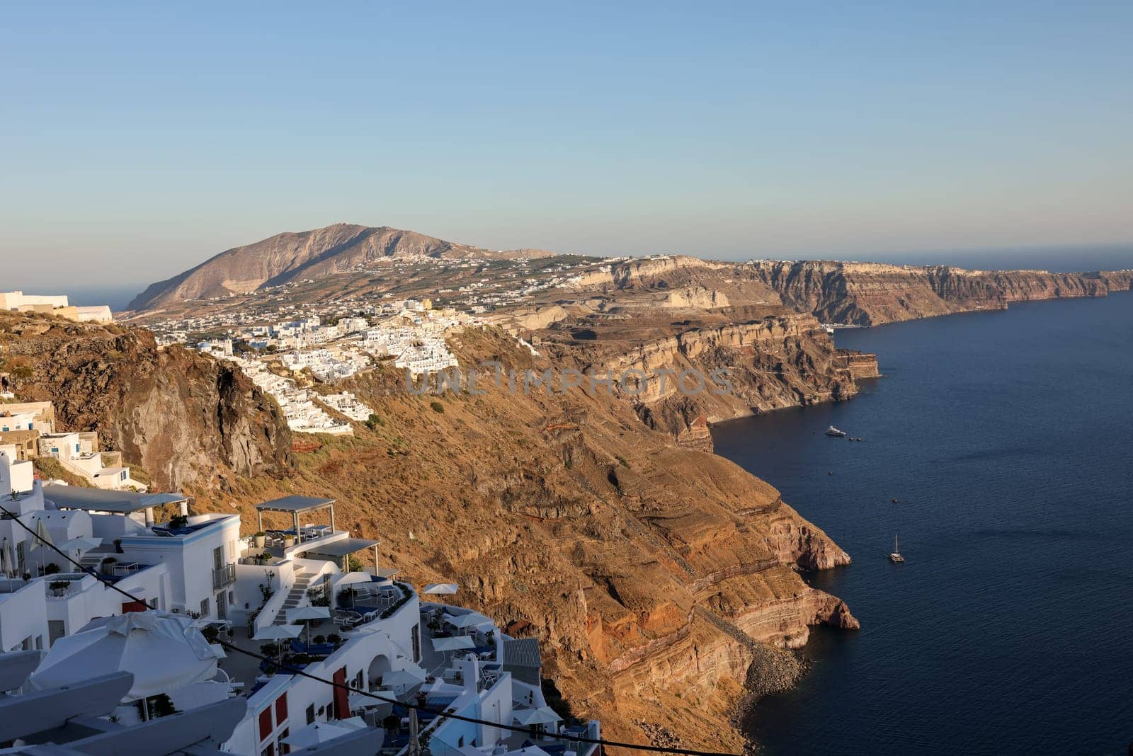 Panoramic view of the Santorini caldera cliffs from the Imerovigli village on Santorini island, Greece