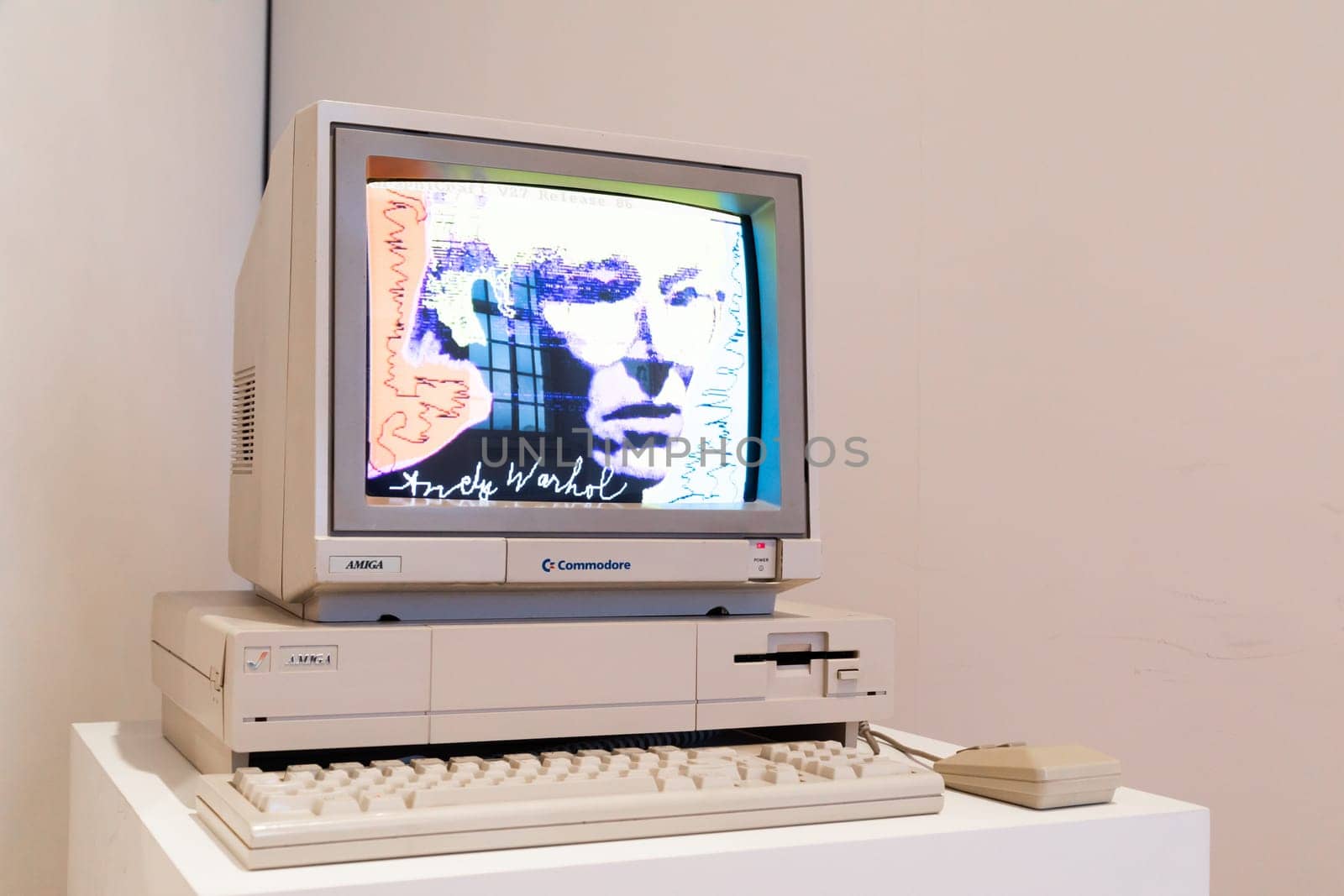 Venaria Reale, Italy - October 2022: Computer Commodore Amiga 1000 with floppy disk, mouse, beige