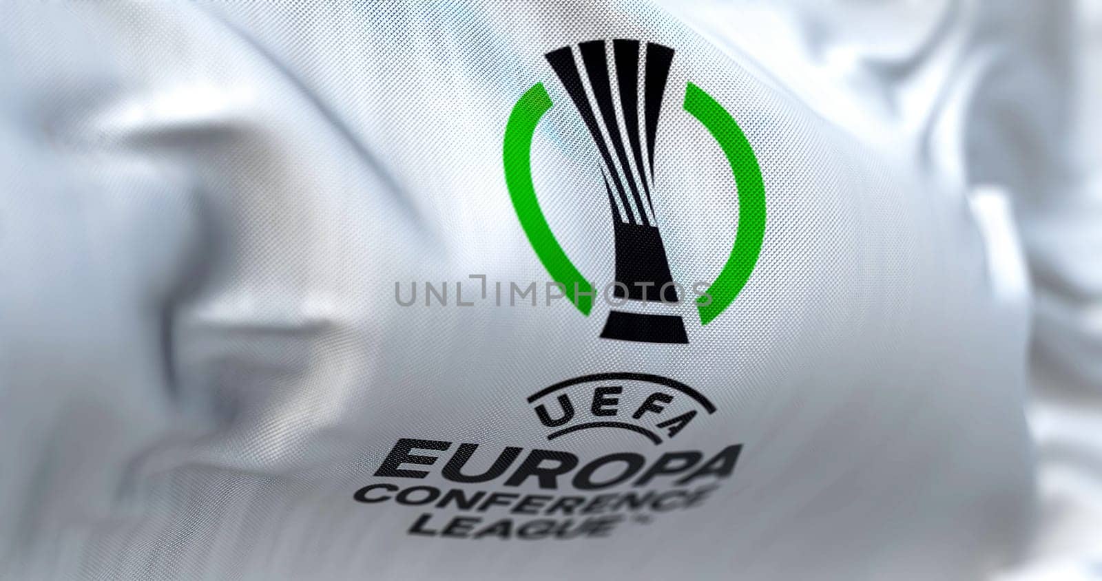 Prague, Czech Rep, July 2022: Close-up view of the UEFA Europa Conference League flag waving. Europa Conference League is an annual football club competition for european clubs. 3D illustration render