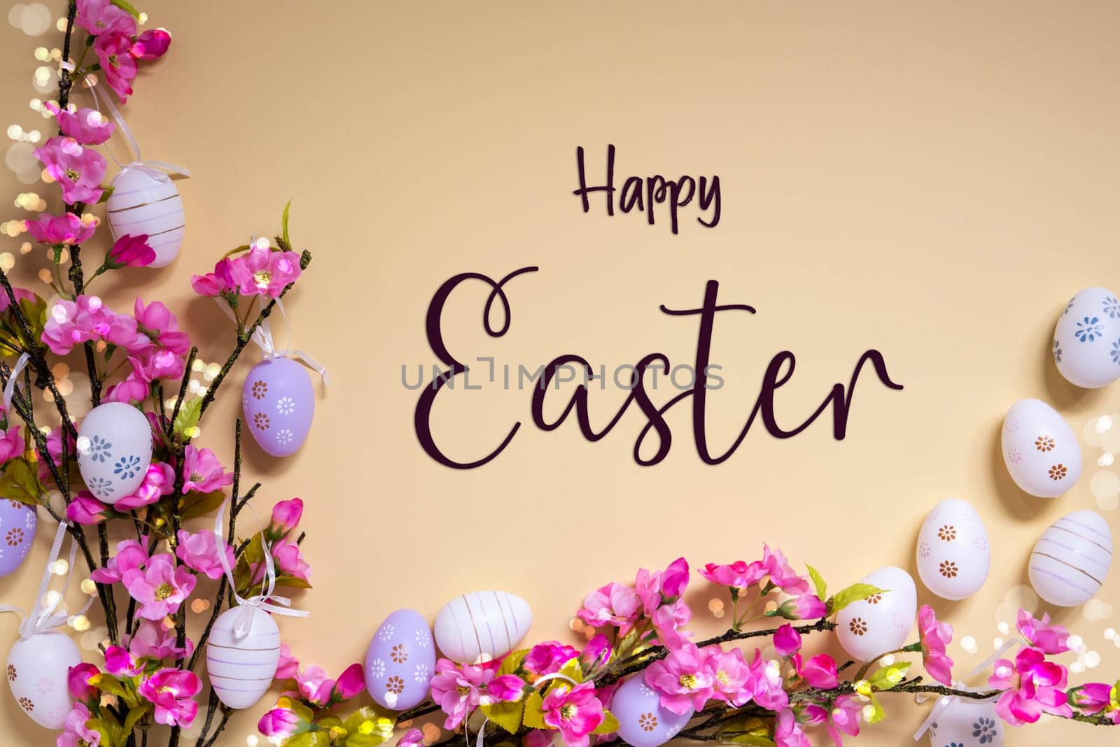 English Text Happy Easter On Beige Background. Pink And Purple, Shiny And Bright Spring Flower Arrangement With Easter Egg Decoration.
