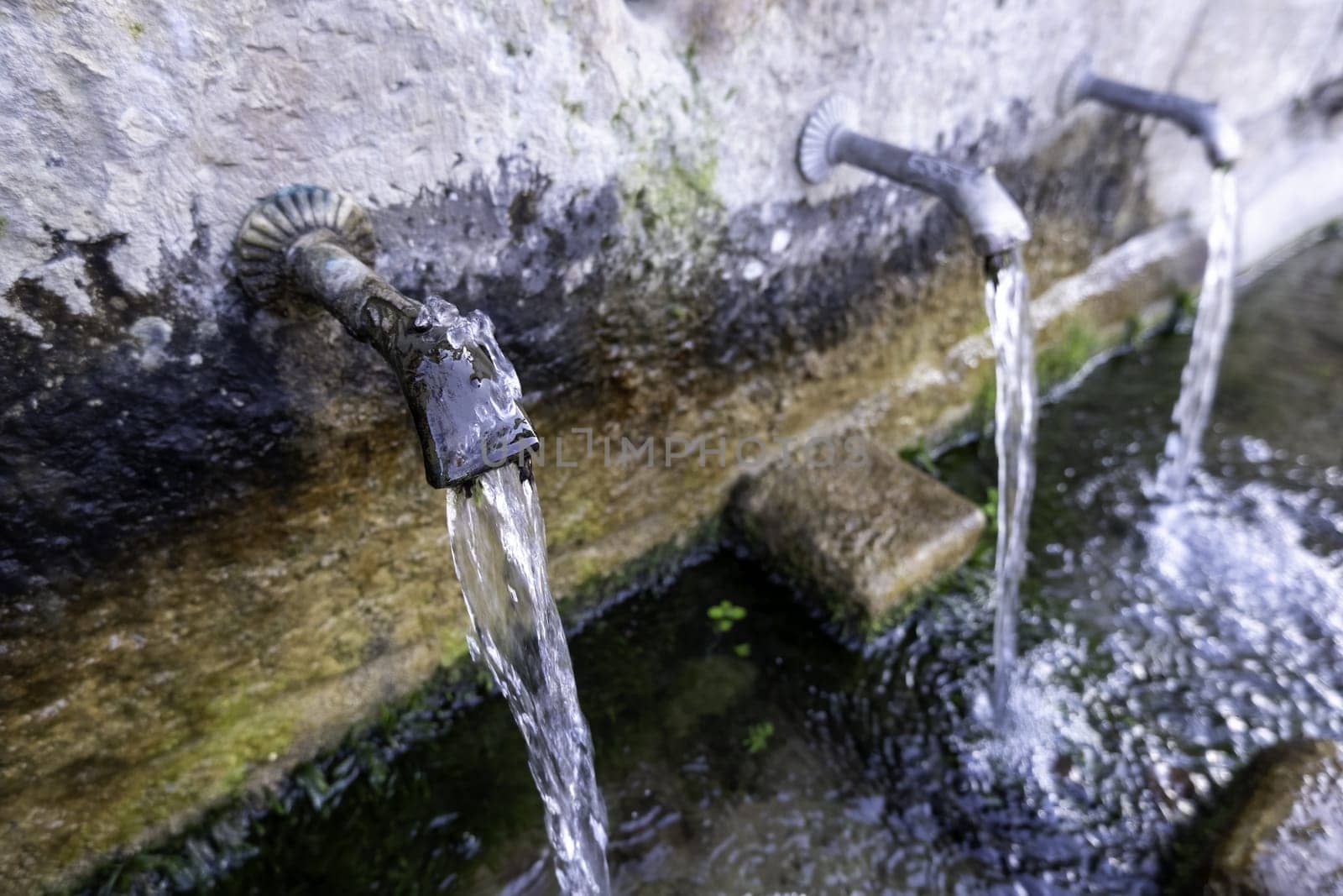 Detail of a fountain with water for human consumption