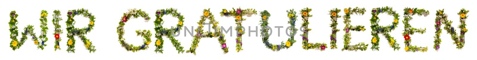 Blooming Flower Letters Building German Text Wir Gratulieren Means Congratulations. Summer And Spring Season Blossoms And Flower Lei.