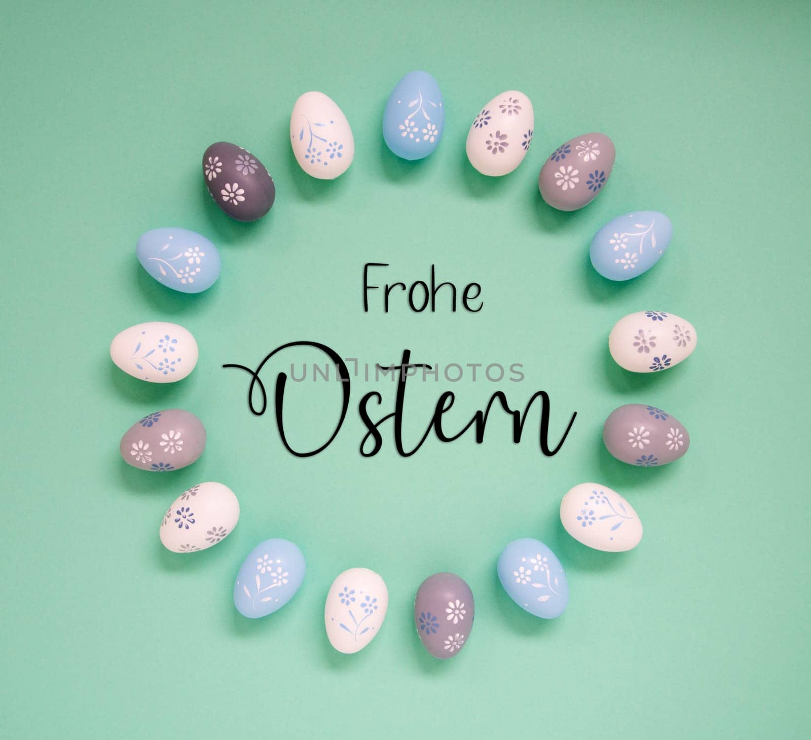 Flat Lay With German Text Frohe Ostern Means Happy Easter. Easter Egg Arrangement, Decoration And Ornament. Light Green Paper Background