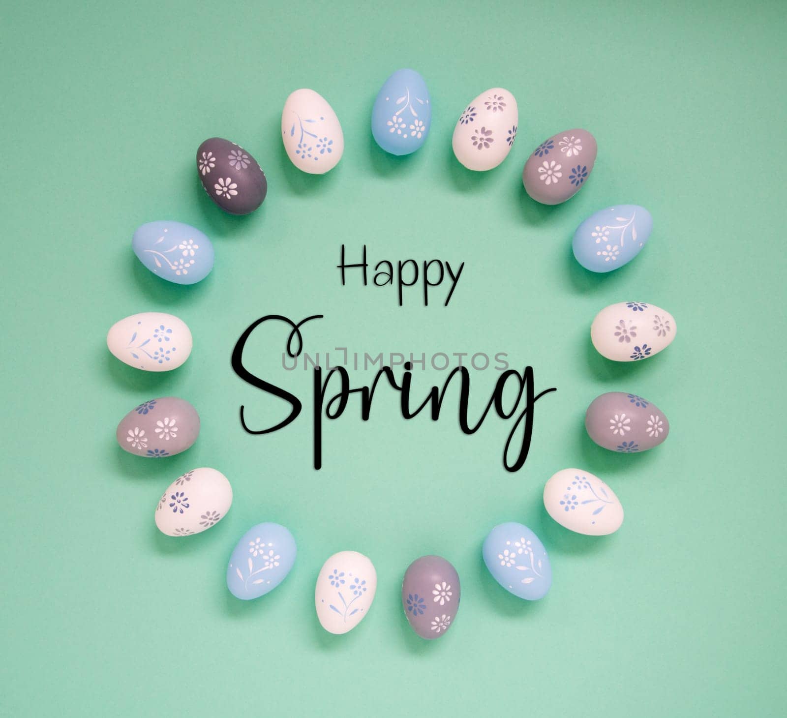 Flat Lay With English Text Happy Spring. Easter Egg Arrangement, Decoration And Ornament. Light Green Paper Background