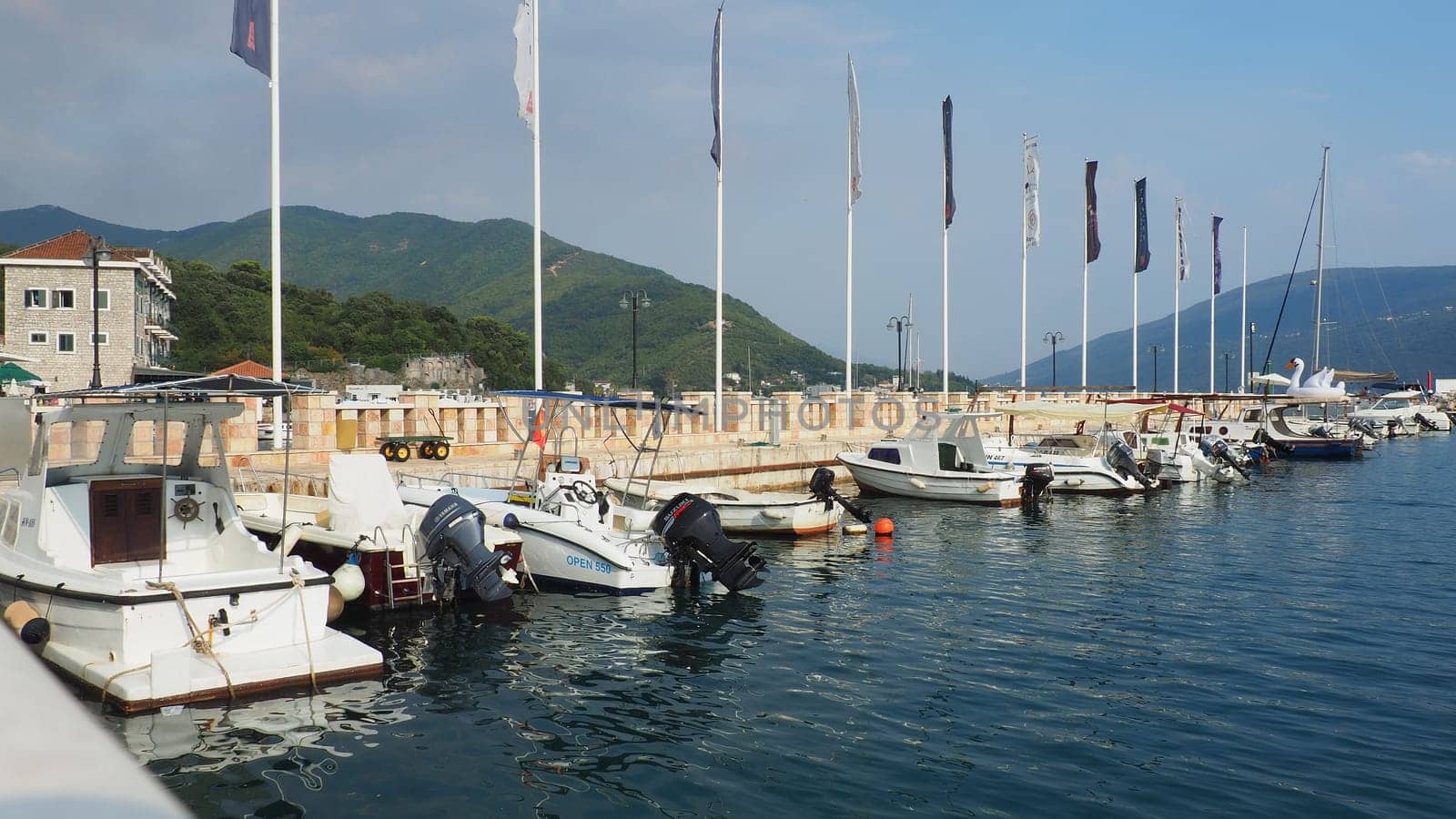 Meljine, Herceg Novi, Montenegro, August 13 2022 Boats, yachts and ships are at anchor. Moored ships in the parking lot. Adriatic Sea Mediterranean. Travel business. Sea travel and sports. Summertime
