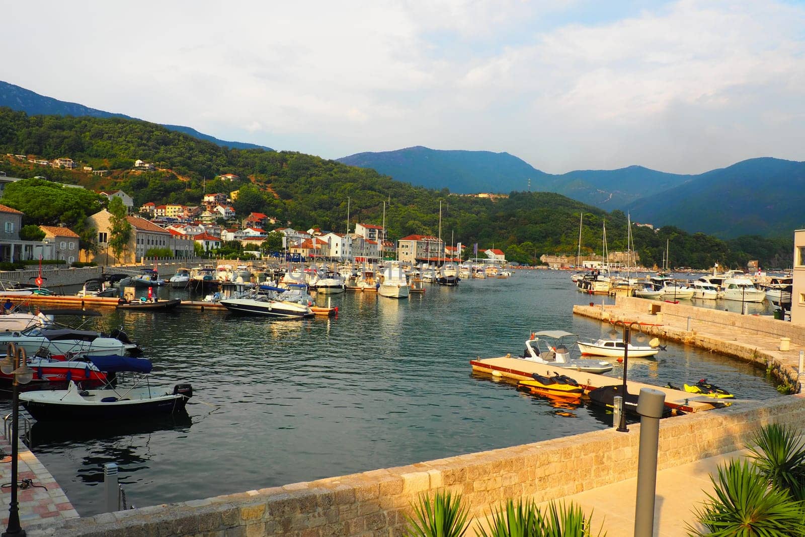 Meljine, Herceg Novi, Montenegro, August 13 2022 Boats, yachts and ships are at anchor. Moored ships in the parking lot. Adriatic Sea Mediterranean. Travel business. Sea travel and sports. Summertime