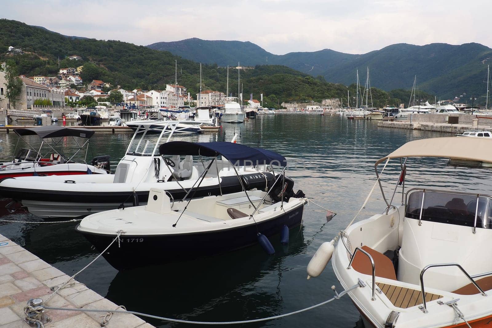 Meljine, Herceg Novi, Montenegro, August 13 2022 Boats, yachts and ships are at anchor. Moored ships in the parking lot. Adriatic Sea Mediterranean. Travel business. Sea travel and sports. Summertime