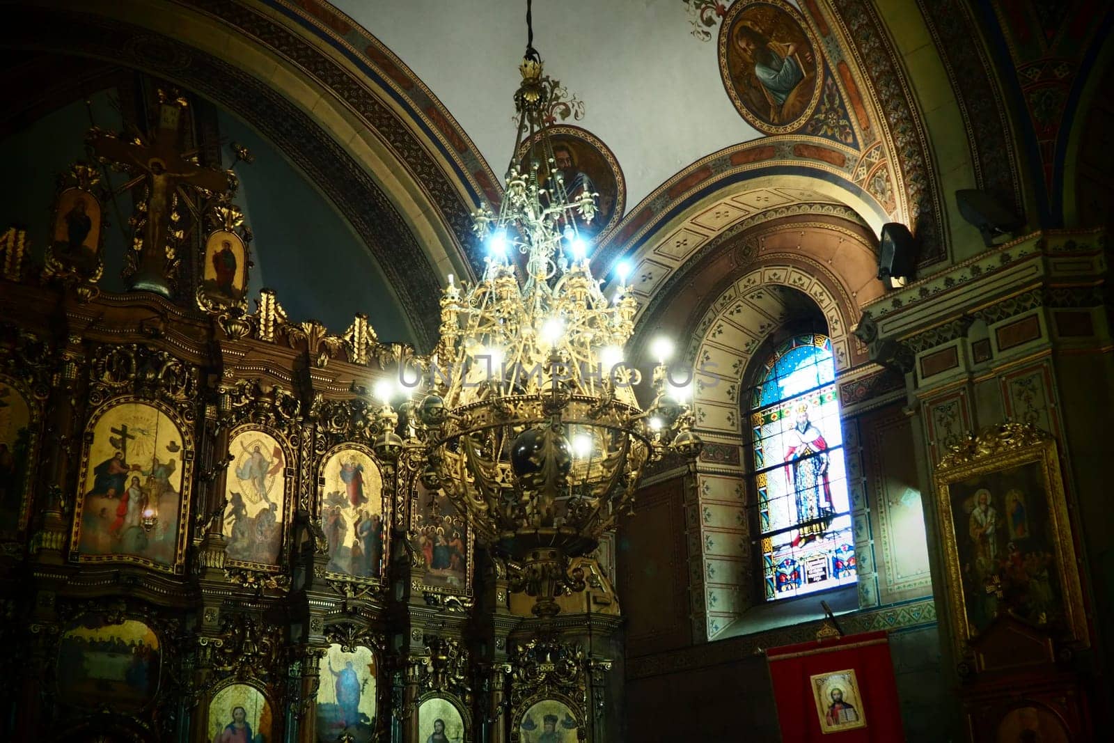 Sremska Mitrovica, Serbia 26 June 2022, Basilica of St. Demetrius, Sabor Church. Altar, icons, a large church chandelier under the arch. Arches and church utensils. Neoclassical architecture. Interior