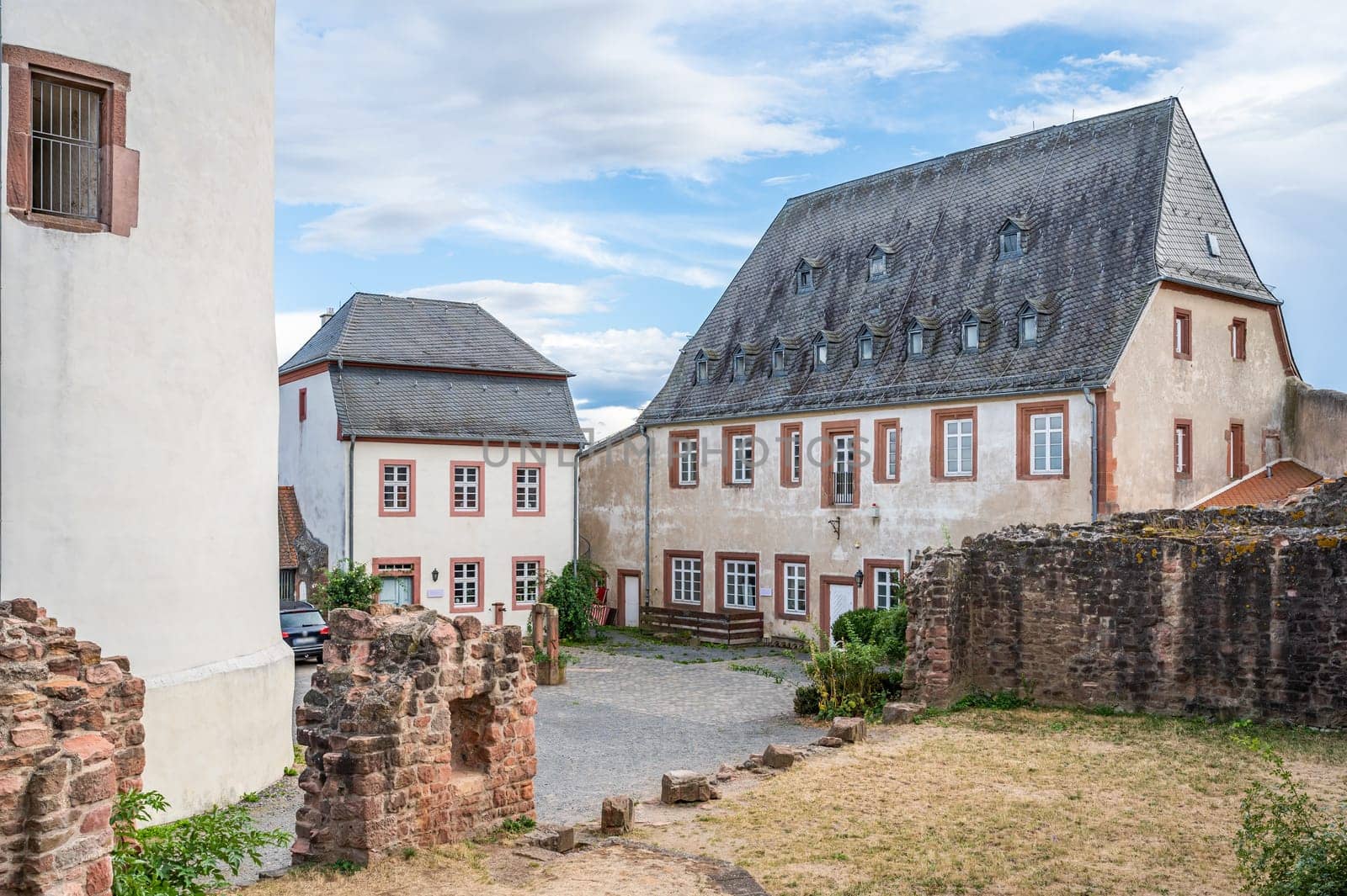 courtyard of the castle veste Otzberg during summer with tower, building facade and wall