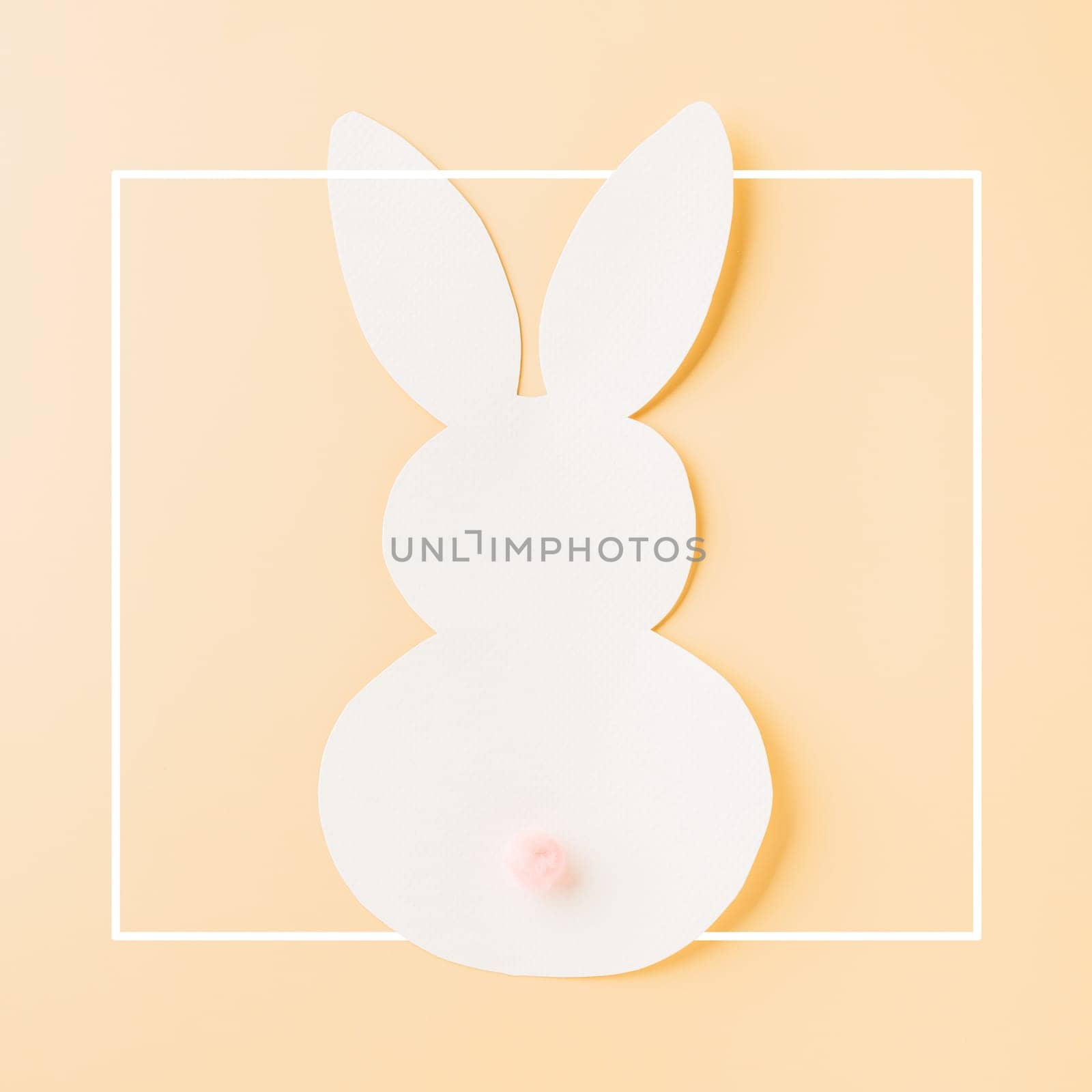 Easter Day Concept. Above overhead handmade white paper rabbit cutting isolated on pastel background with copy space for your text, Happy Easter Bunny holiday, Banner design for web