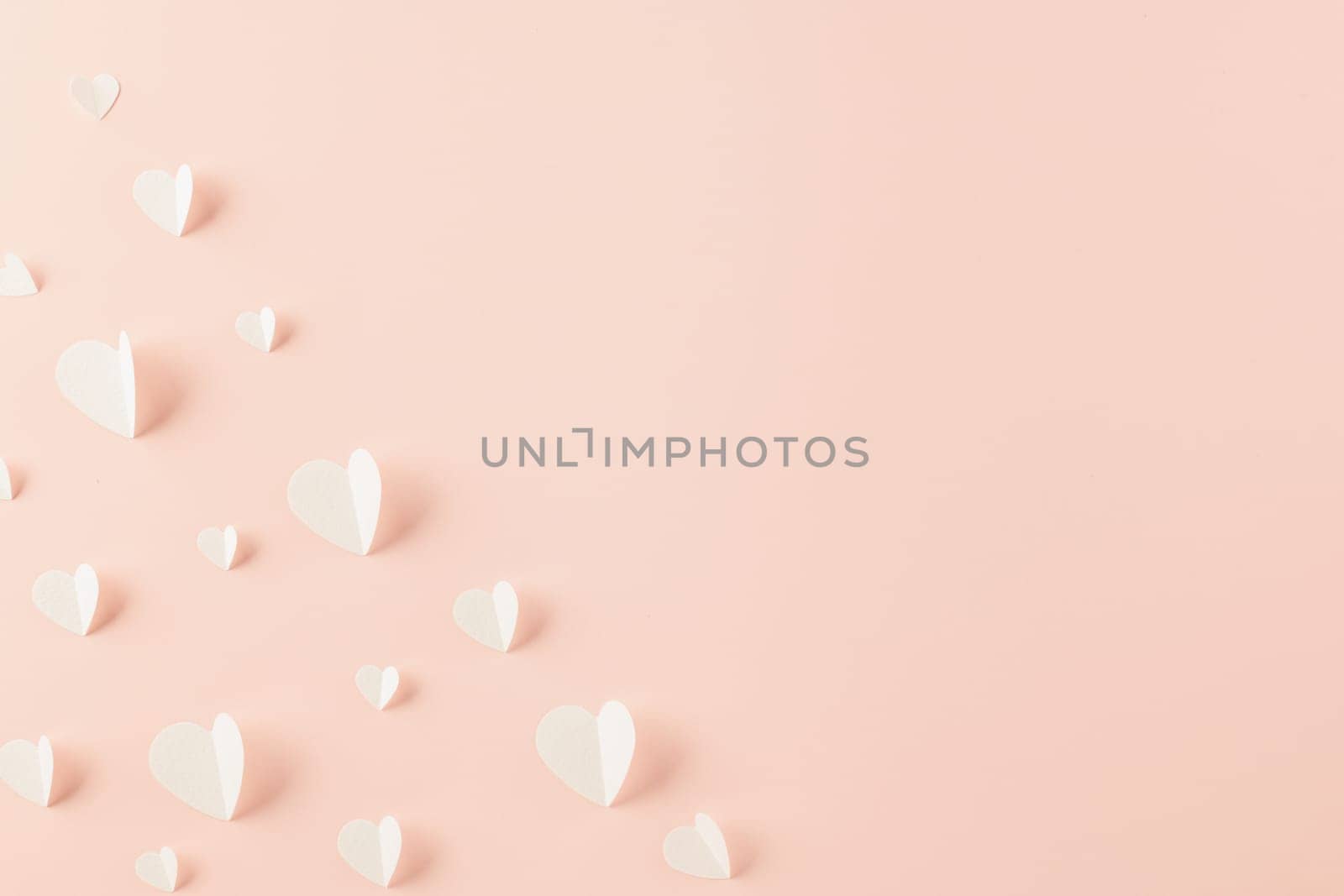 Happy Valentines Day background. Top view flat lay of paper elements cutting white hearts shape flying on pink background with copy space, Happy Mother's Day, Banner template design of holiday