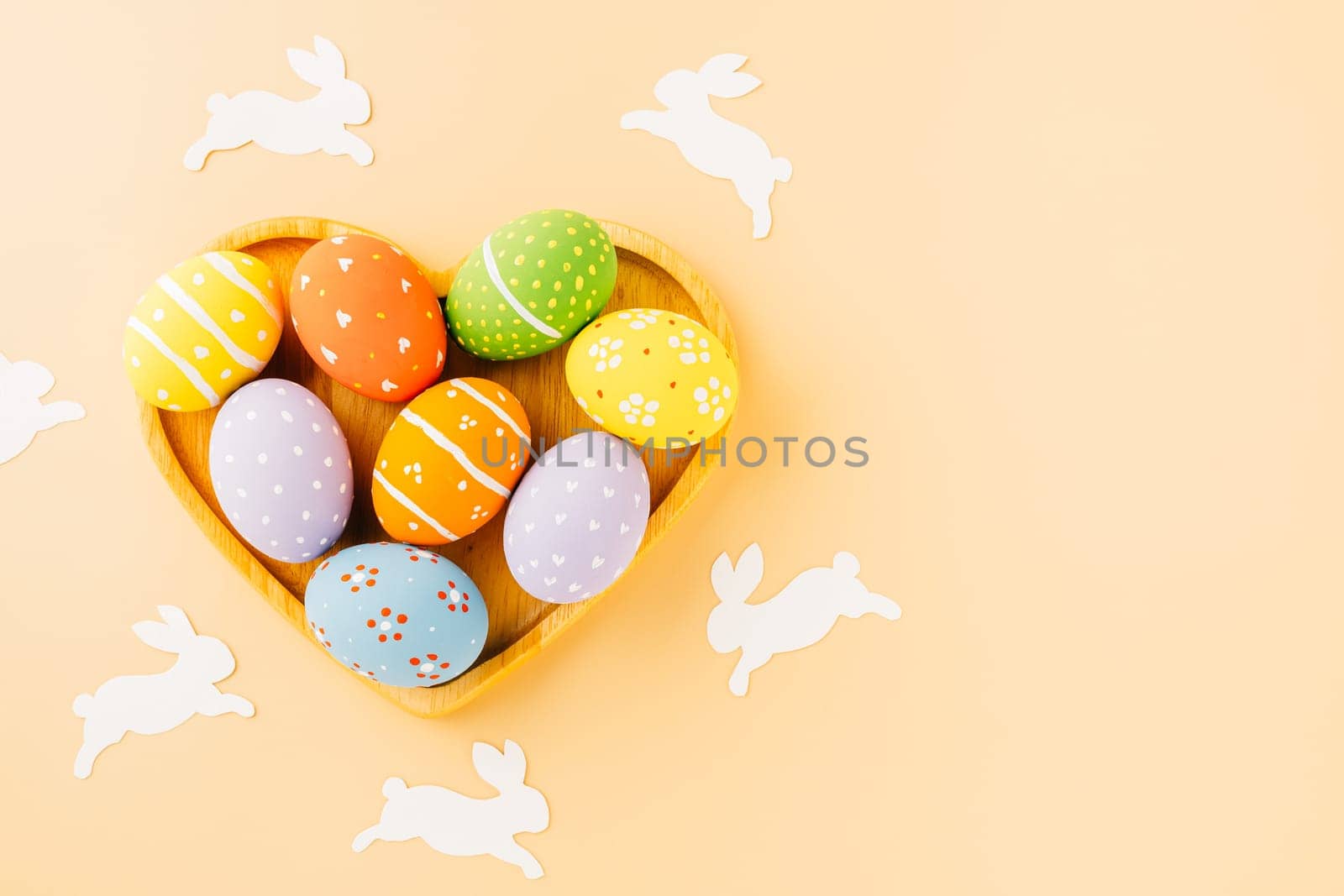 Overhead easter eggs with rabbit paper cut in shape heart isolated on pastel background, Funny decoration paper round blank, Happy Easter Day greeting card, composition banner web design holiday