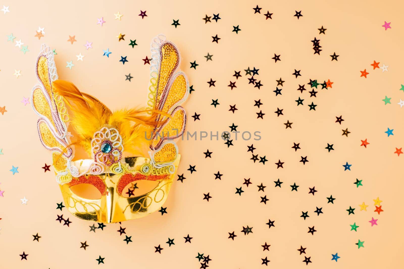 Happy Purim carnival decoration. Jewish Purim and Mardi Gras in Hebrew, celebration holiday background banner design, Golden venetian ball mask, carnival mask isolated on pastel background