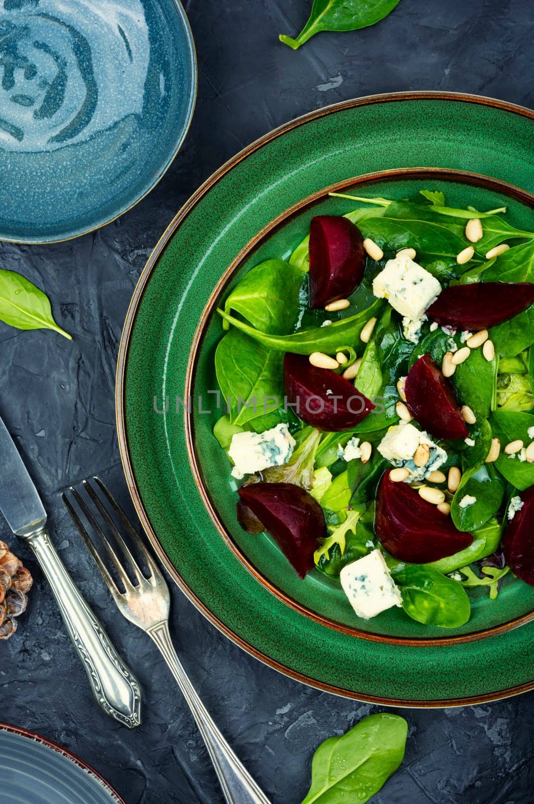 Spring or summer salad with beetroot, cheese, herbs and pine nuts. Diet detox raw food