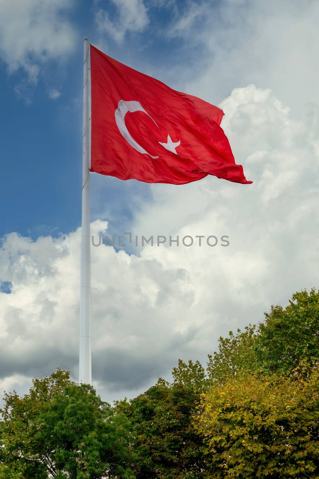 Turkish flag at Camlica Park against heavy clouds in a summer day, Uskudar district, Istanbul, Turkey