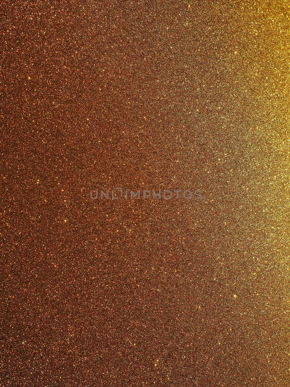 Bokeh light of gold glitters. Golden glitter texture background. Sparkling glitter wrapping paper with sequins and sparkles. Festive golden bokeh and glitter. Beautiful background