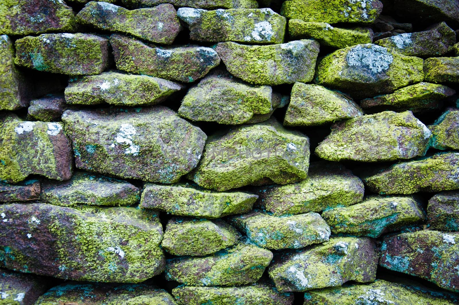 Closeup on a dry stone wall in yorkshire countryside, UK. Building materials pattern