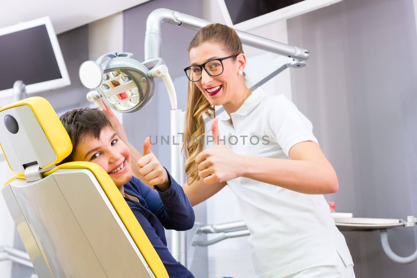 Dentist treats patient in dental practice